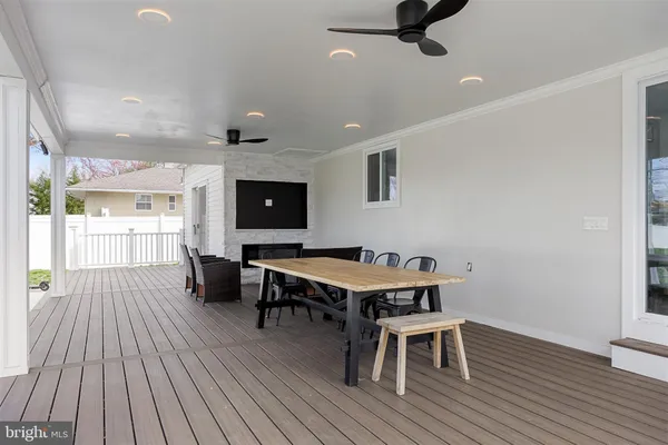 a view of a dining room with furniture wooden floor and chandelier