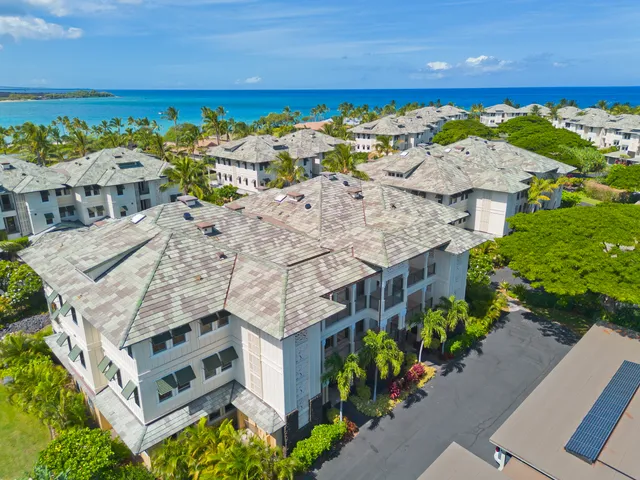 an aerial view of a house with a swimming pool
