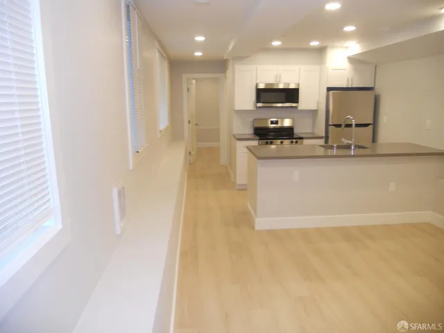 a view of a kitchen with a sink