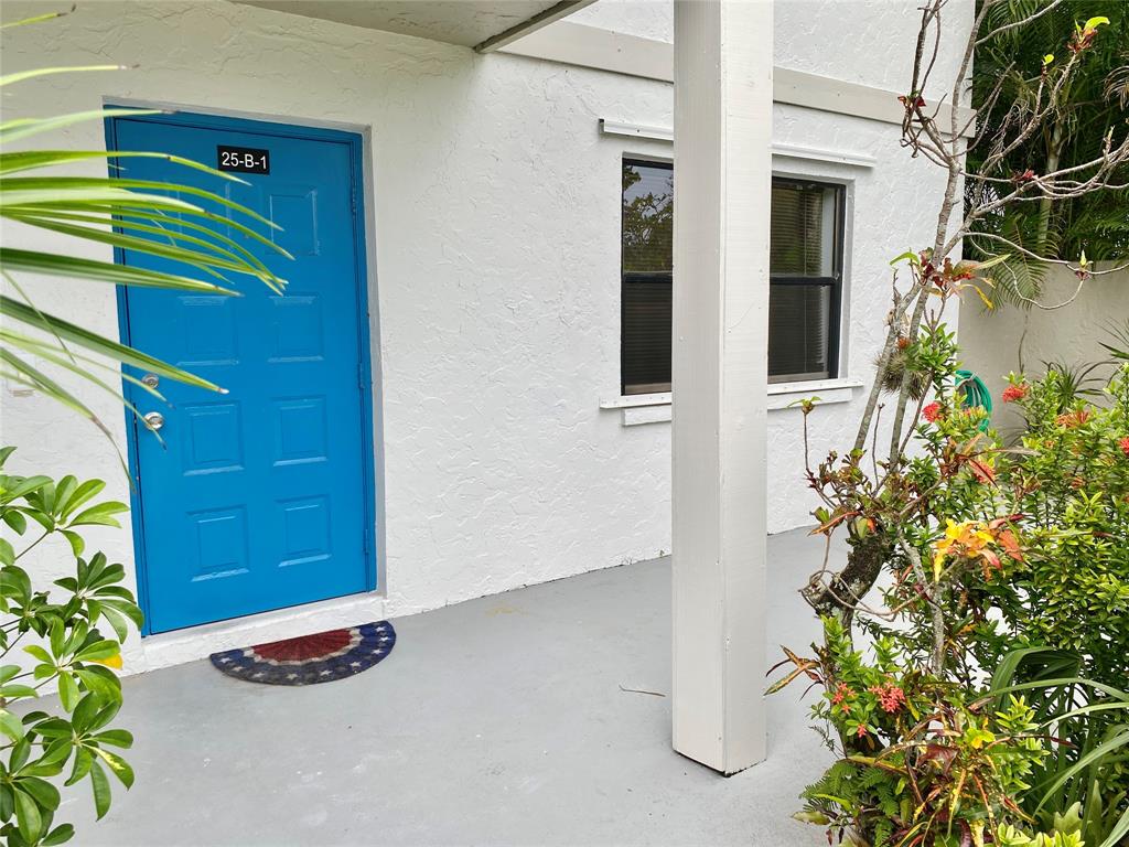 3122 Southwest 20th Terrace, Unit 25B1 Delray Beach, FL 33445 - Photo 17 of 21 a view of outdoor space and porch