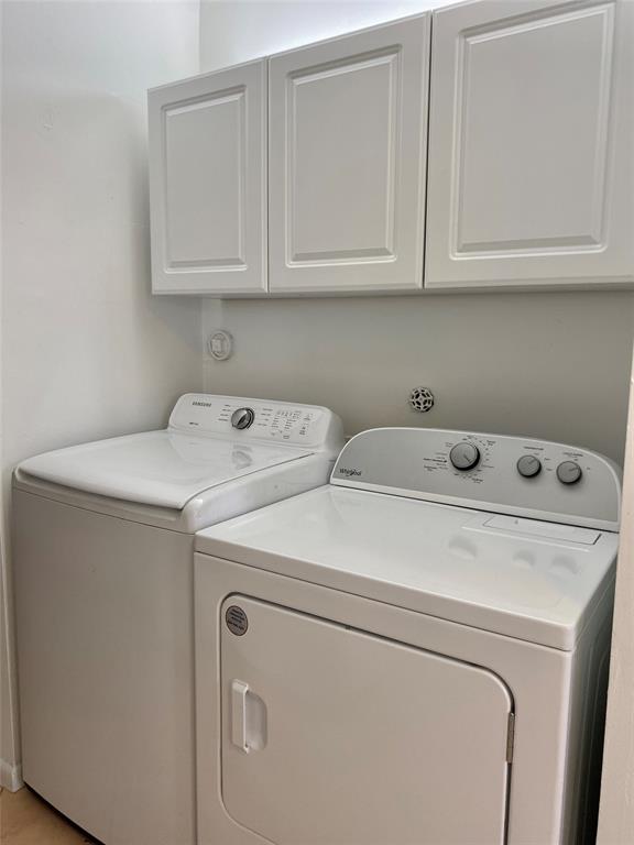 3122 Southwest 20th Terrace, Unit 25B1 Delray Beach, FL 33445 - Photo 9 of 21 a utility room with dryer and washer