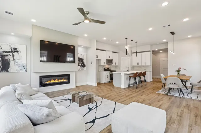 a living room with furniture and a fireplace