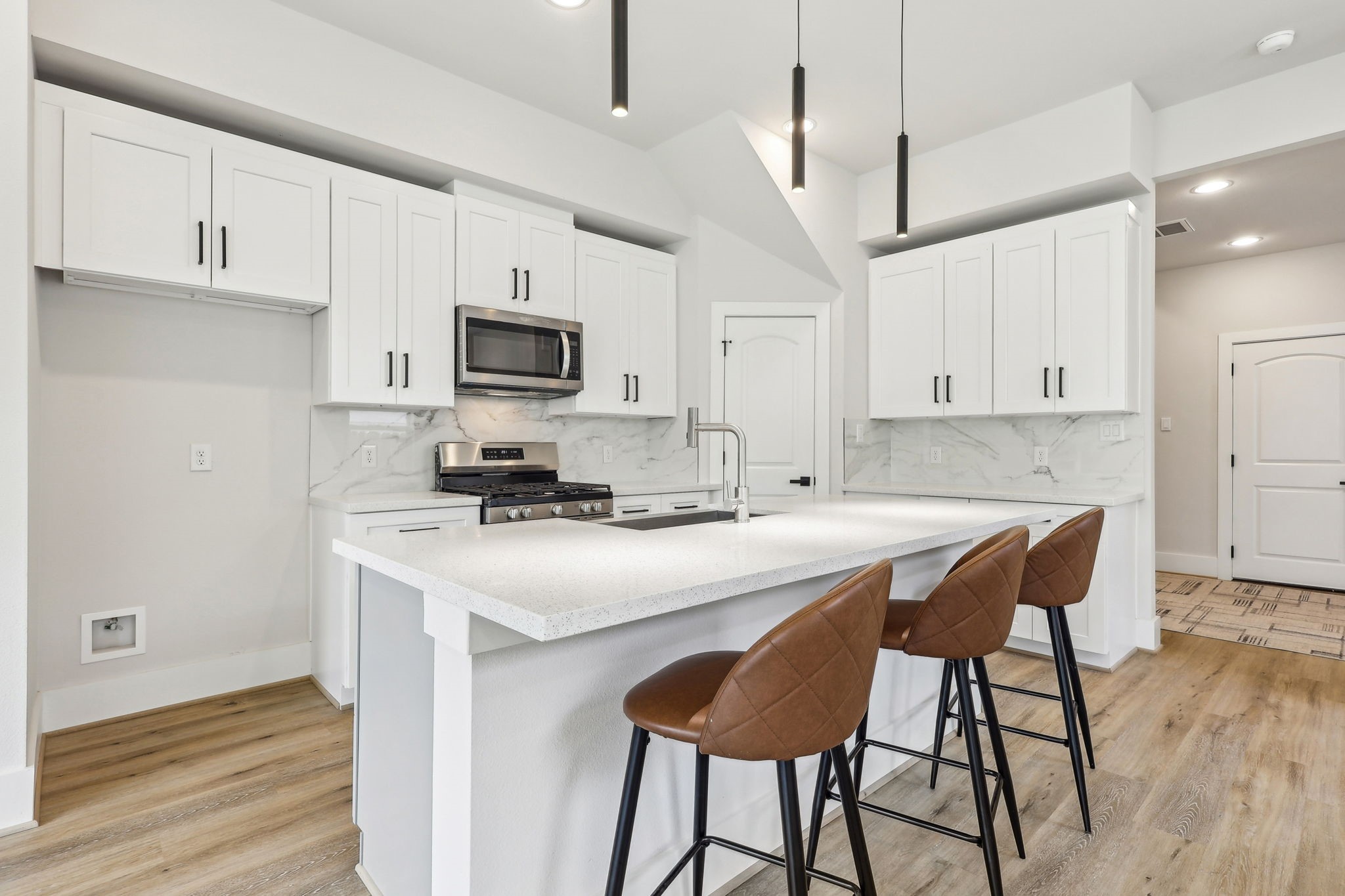 3722 Nathaniel Brown Street Houston, TX 77021 - Photo 11 of 30 a kitchen with stainless steel appliances a stove a sink a refrigerator and a microwave