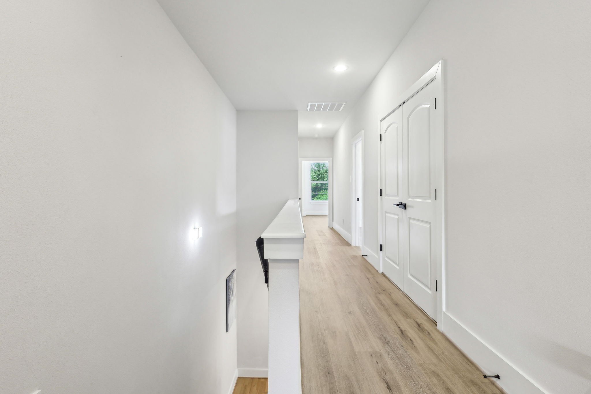 3722 Nathaniel Brown Street Houston, TX 77021 - Photo 14 of 30 a view of a hallway with wooden floor and staircase