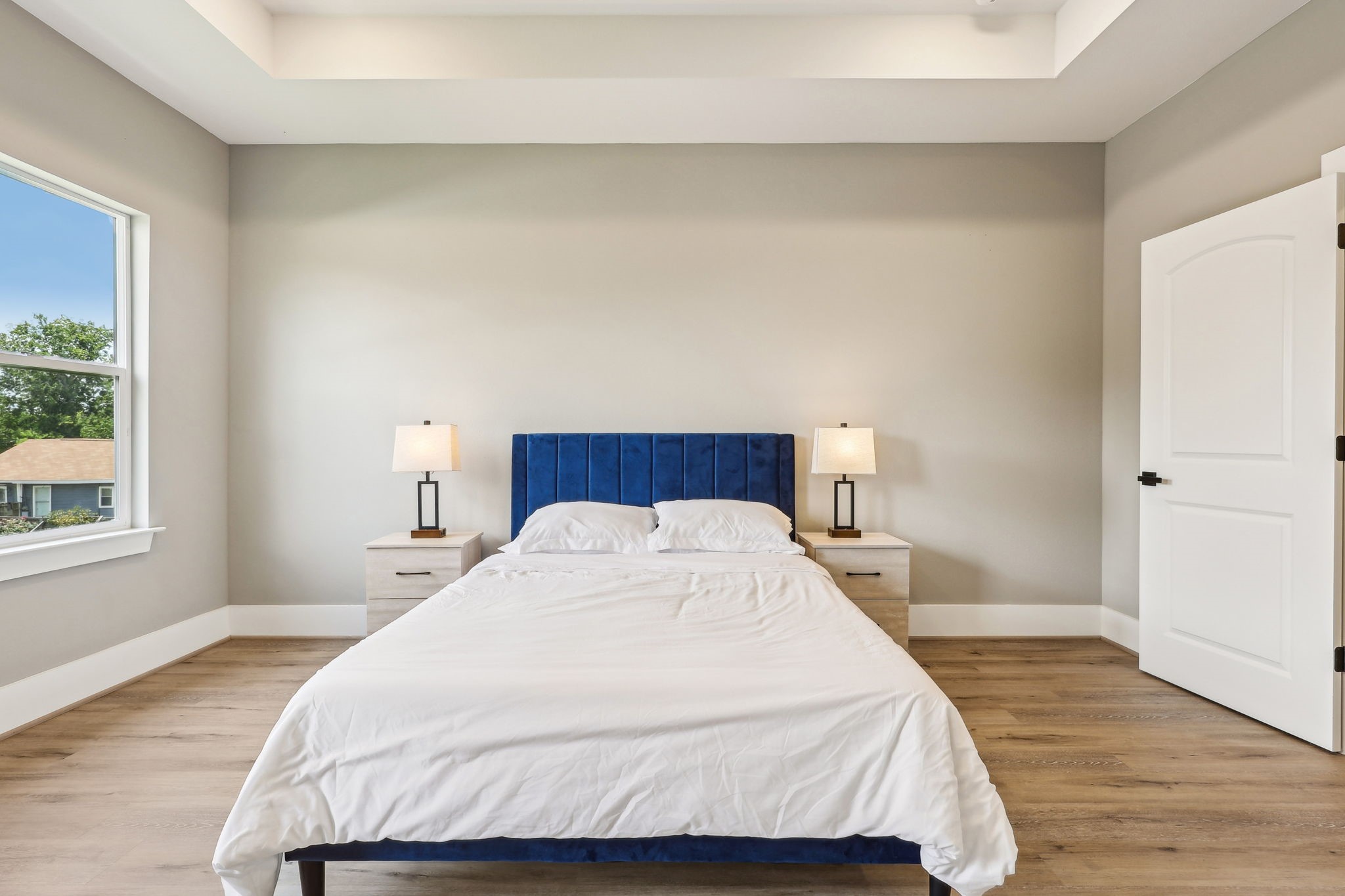 3722 Nathaniel Brown Street Houston, TX 77021 - Photo 18 of 30 a bedroom with a bed and wooden floor