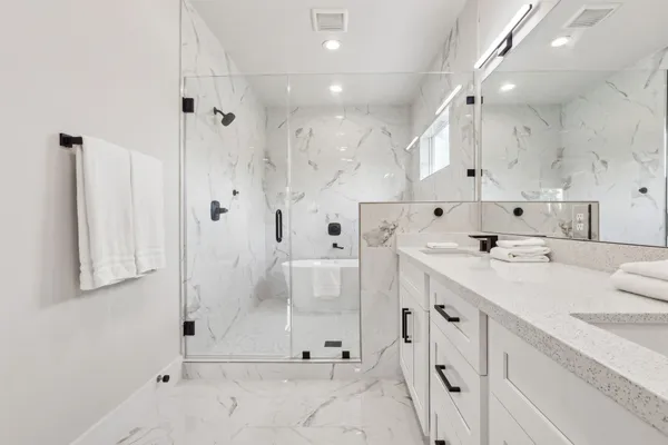 a white bath tub sitting in a bathroom