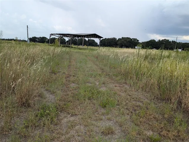 a view of a lake with houses in the back