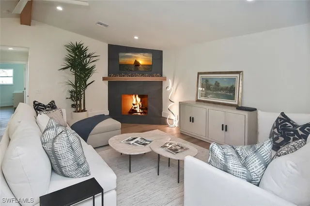 a bedroom with a bed and a lamp