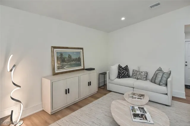 a bathroom with a double vanity sink toilet and shower
