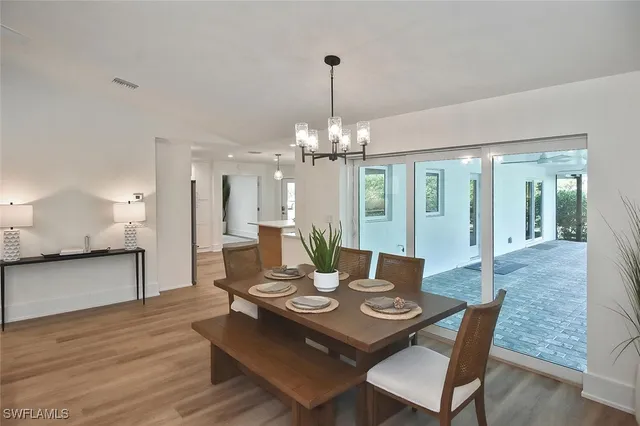 a white bath tub sitting next to a shower
