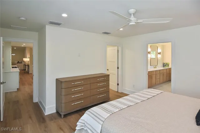 a swimming pool with outdoor seating and a garden