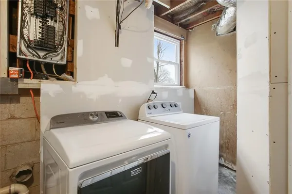 a utility room with dryer and washer