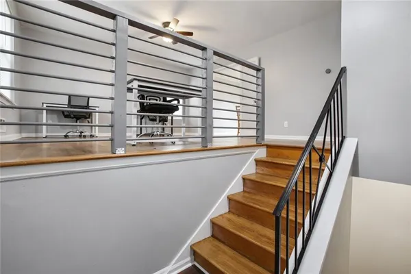 a view of entryway and hall with wooden floor