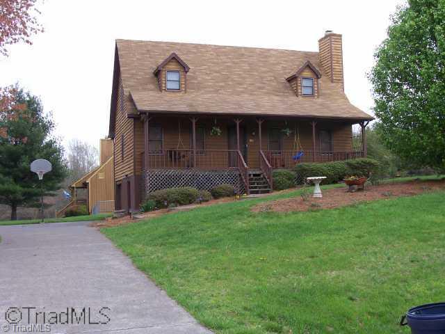 1136 Ridgecliff Drive Rural Hall, NC 27045 - Photo 1 of 9 Exterior Front. Front of Home w/ Paved Driveway and Large Yard