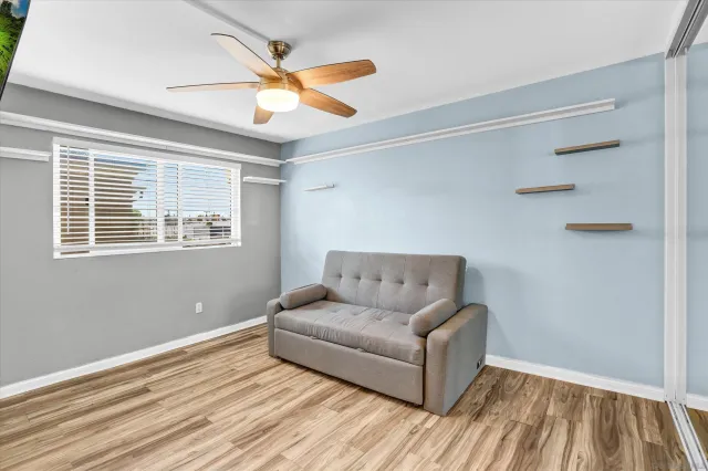 a living room with furniture and a window