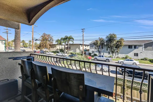a view of a balcony with furniture