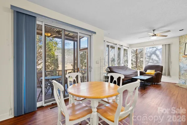 a view of a dining room with furniture window and wooden floor