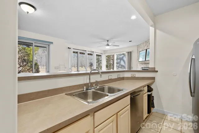 a kitchen with a sink and a window