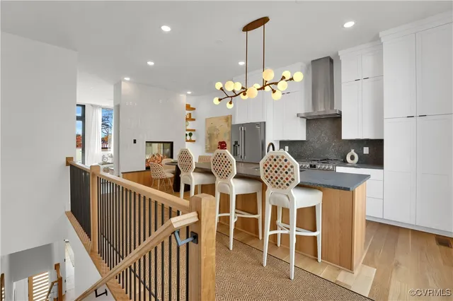 a dinning room filled with furniture and wooden floor