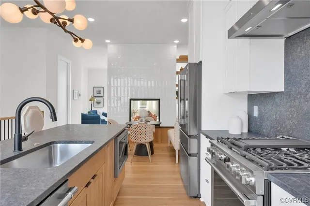 a kitchen with granite countertop a stove and a sink