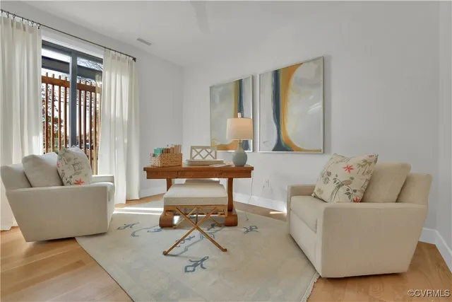 a living room with furniture and a window