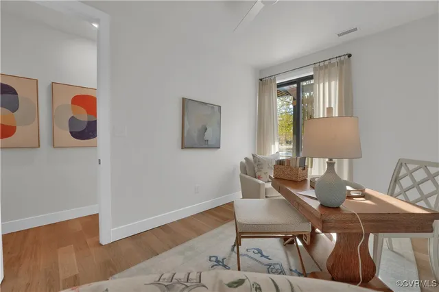 a view of a dining room with furniture and wooden floor