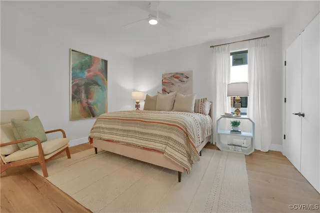 a spacious bedroom with a bed and a couch