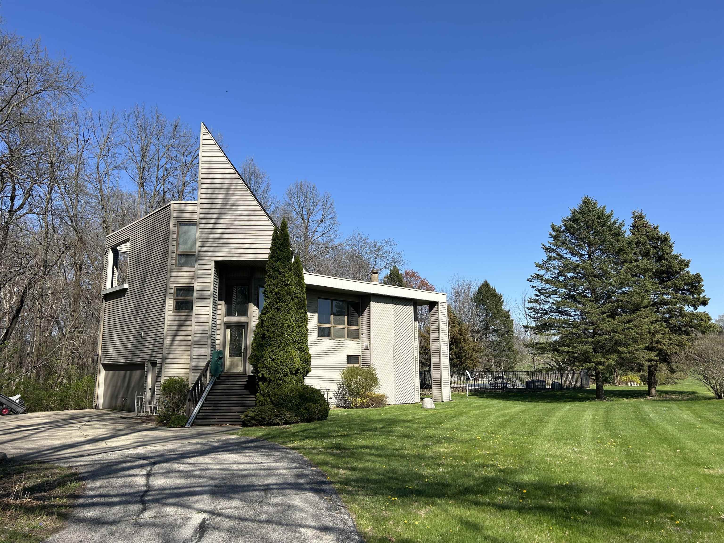 18573 Caledonia Road Caledonia, IL 61011 - Photo 1 of 36 a front view of a house with a yard