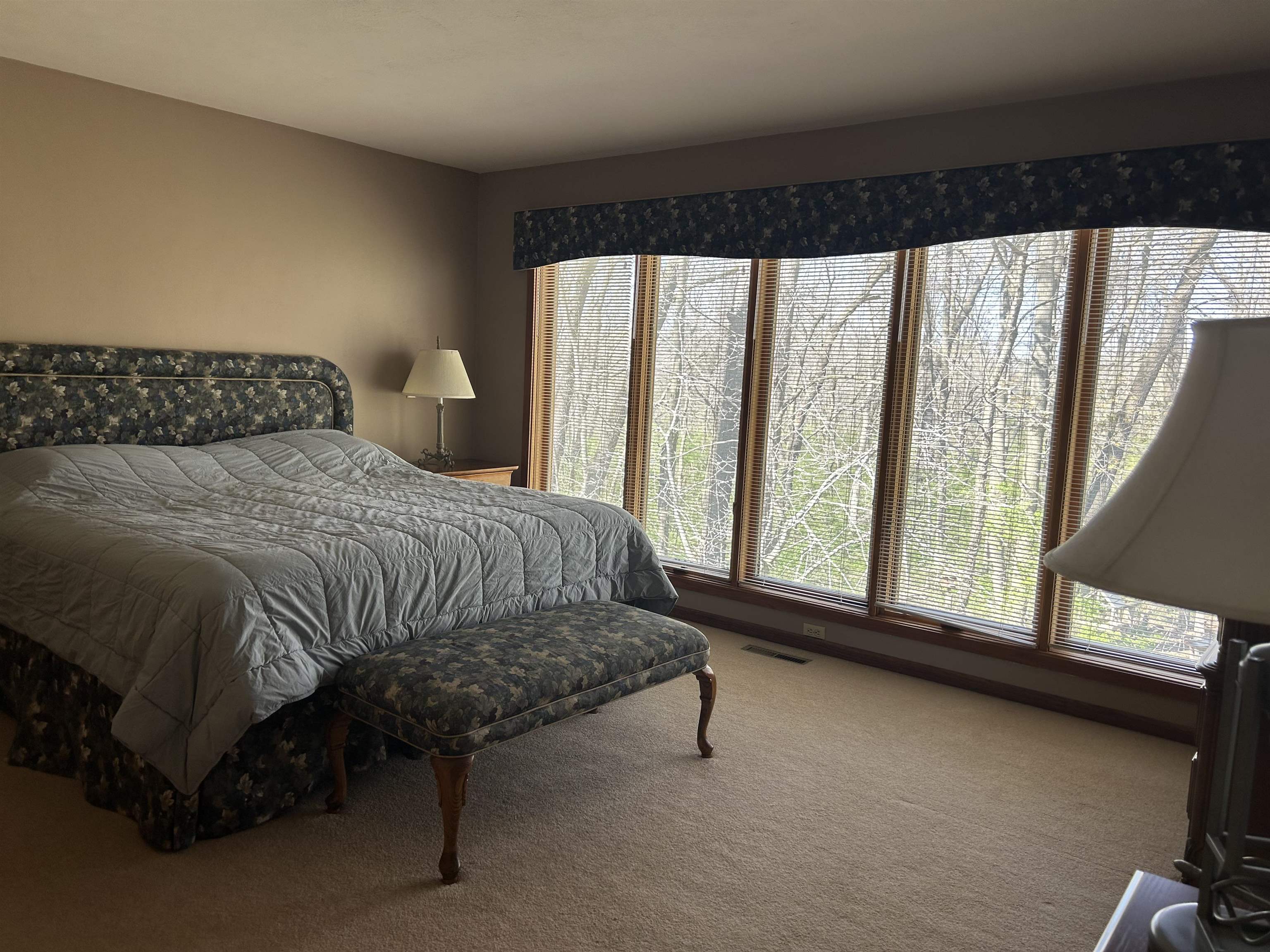 18573 Caledonia Road Caledonia, IL 61011 - Photo 14 of 36 a bedroom with a bed and a large window