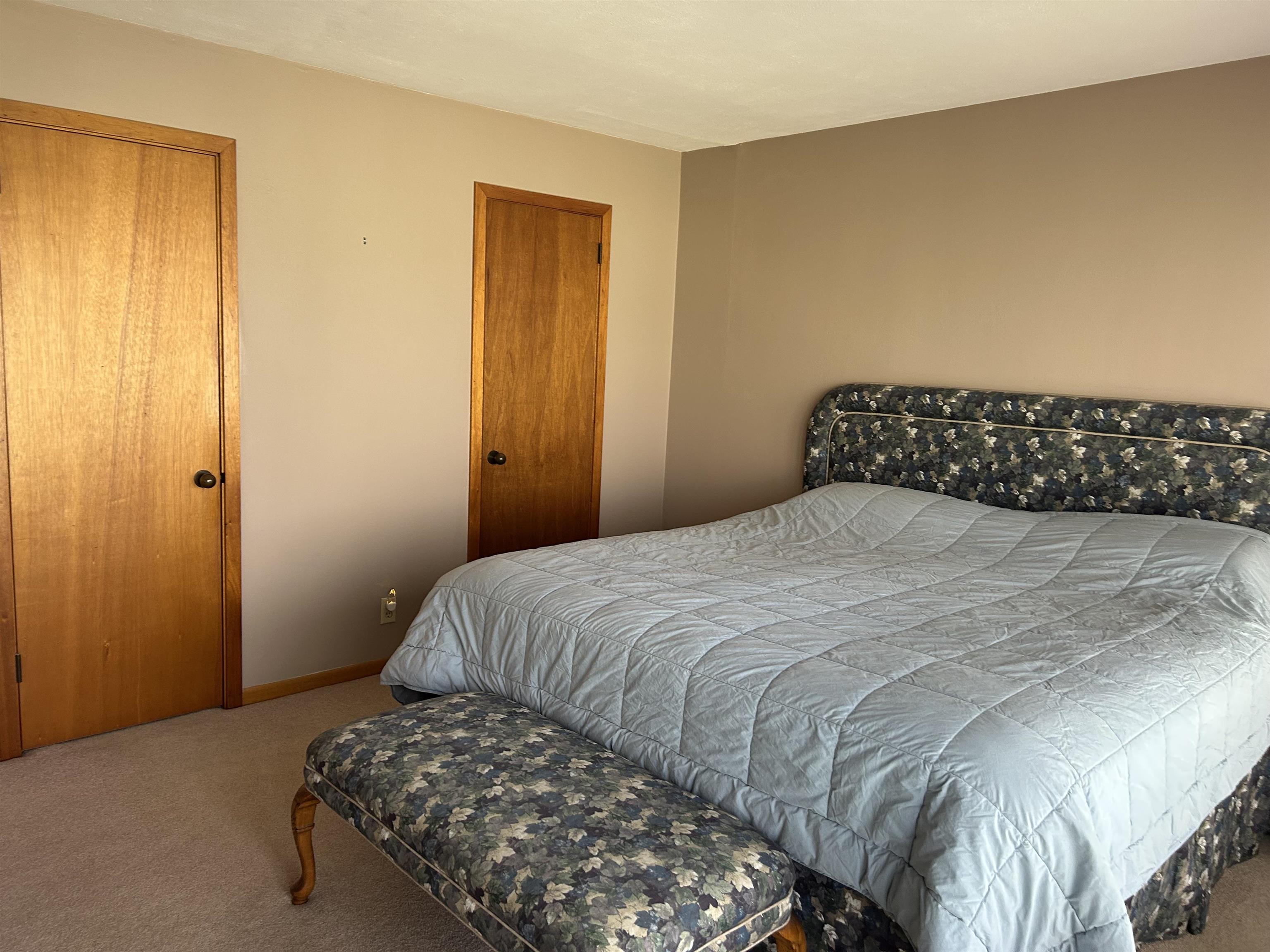18573 Caledonia Road Caledonia, IL 61011 - Photo 15 of 36 a bedroom with a bed and a cabinets