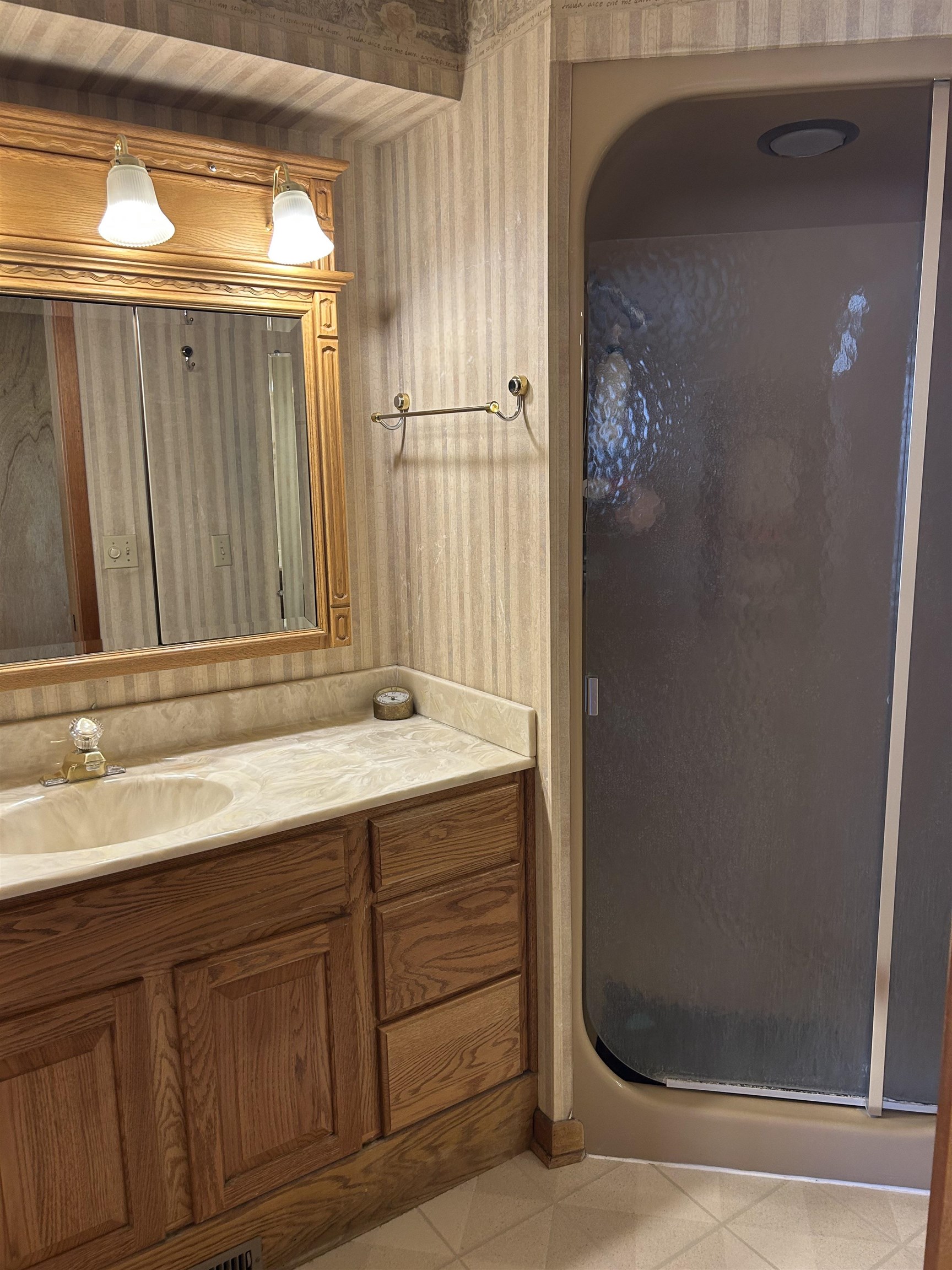 18573 Caledonia Road Caledonia, IL 61011 - Photo 16 of 36 a bathroom with a granite countertop sink and a mirror