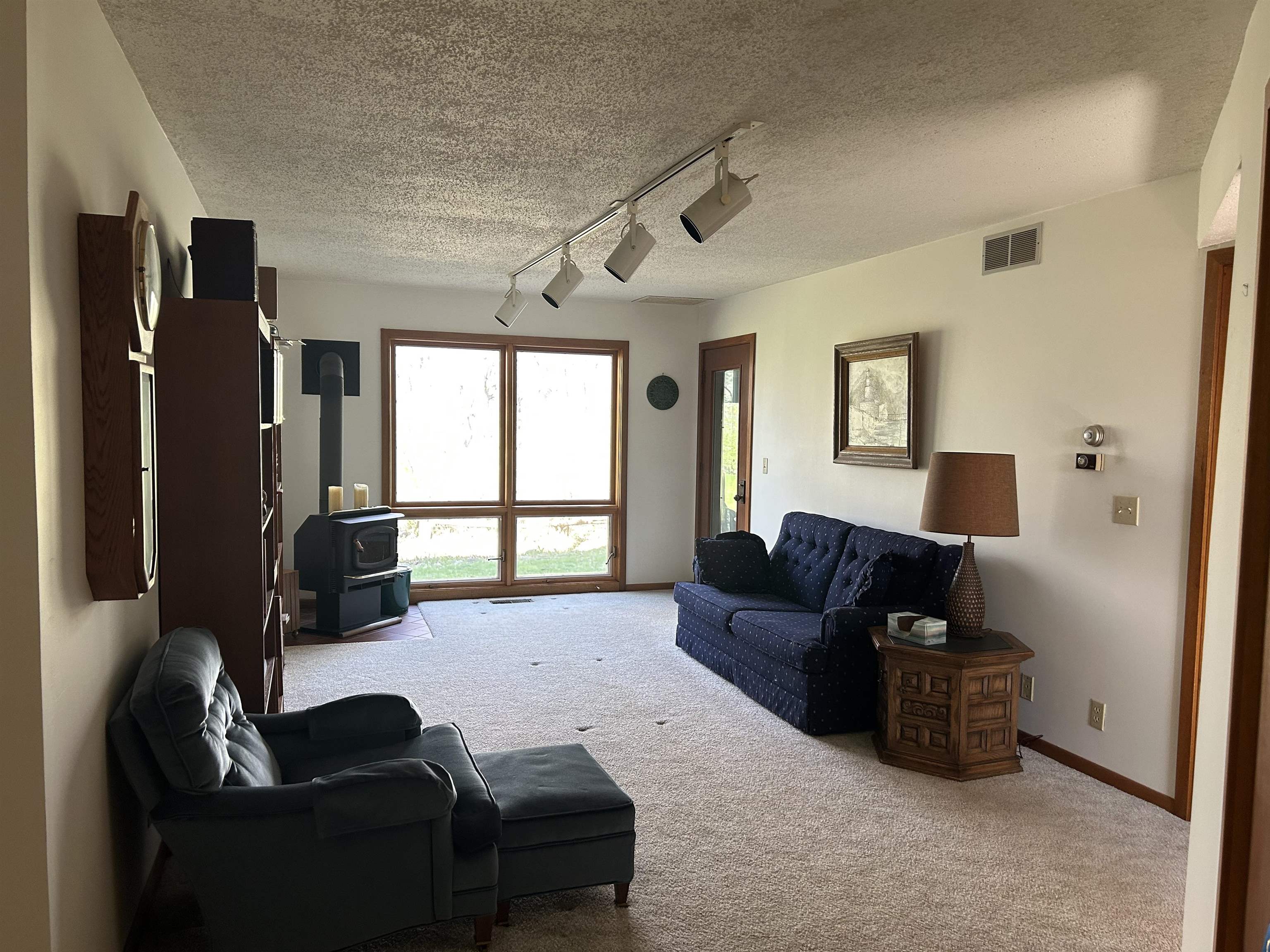 18573 Caledonia Road Caledonia, IL 61011 - Photo 22 of 36 a living room with furniture and a window