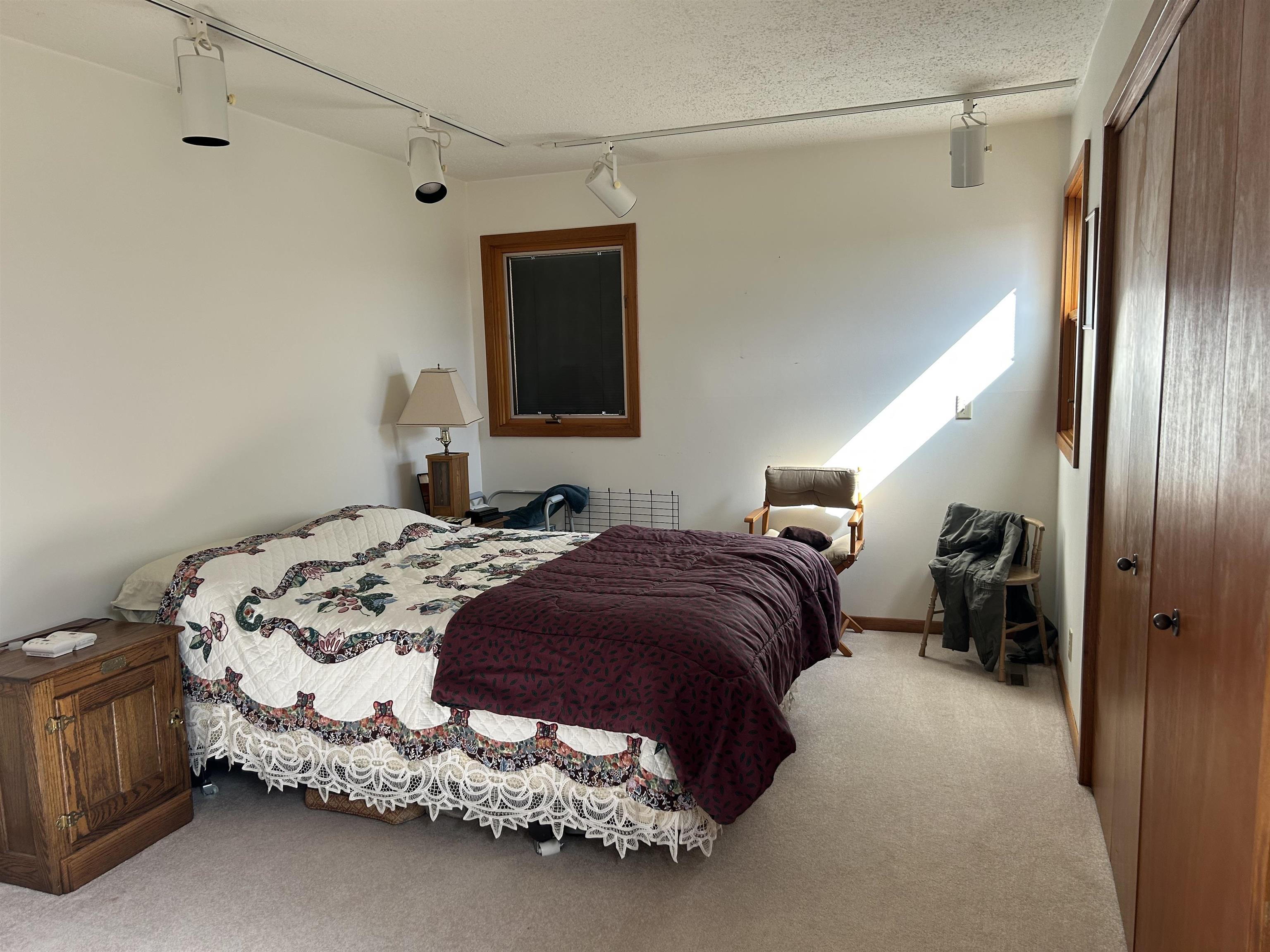 18573 Caledonia Road Caledonia, IL 61011 - Photo 23 of 36 a bedroom with a bed and a window