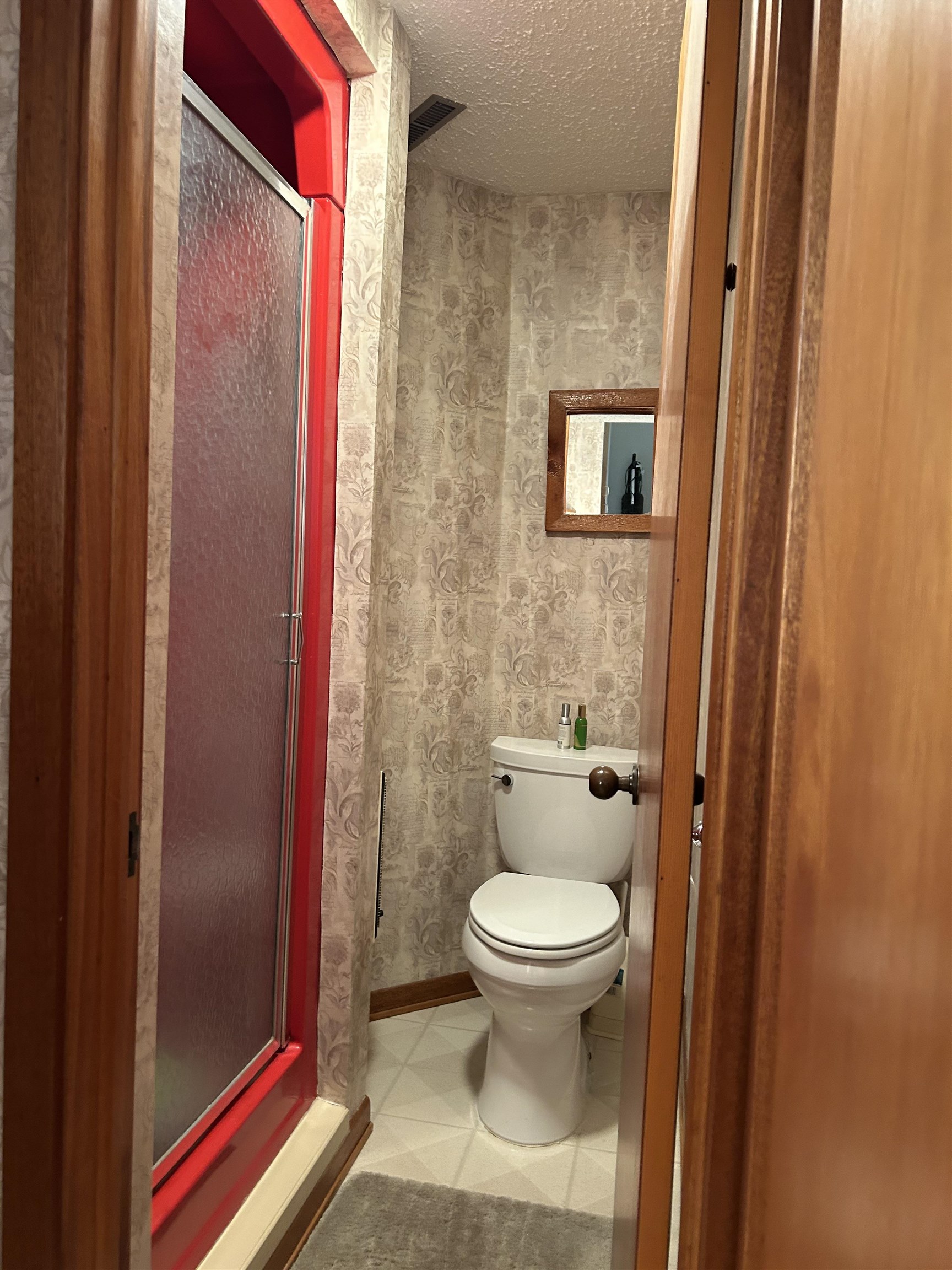 18573 Caledonia Road Caledonia, IL 61011 - Photo 28 of 36 a bathroom with a toilet and a shower curtain