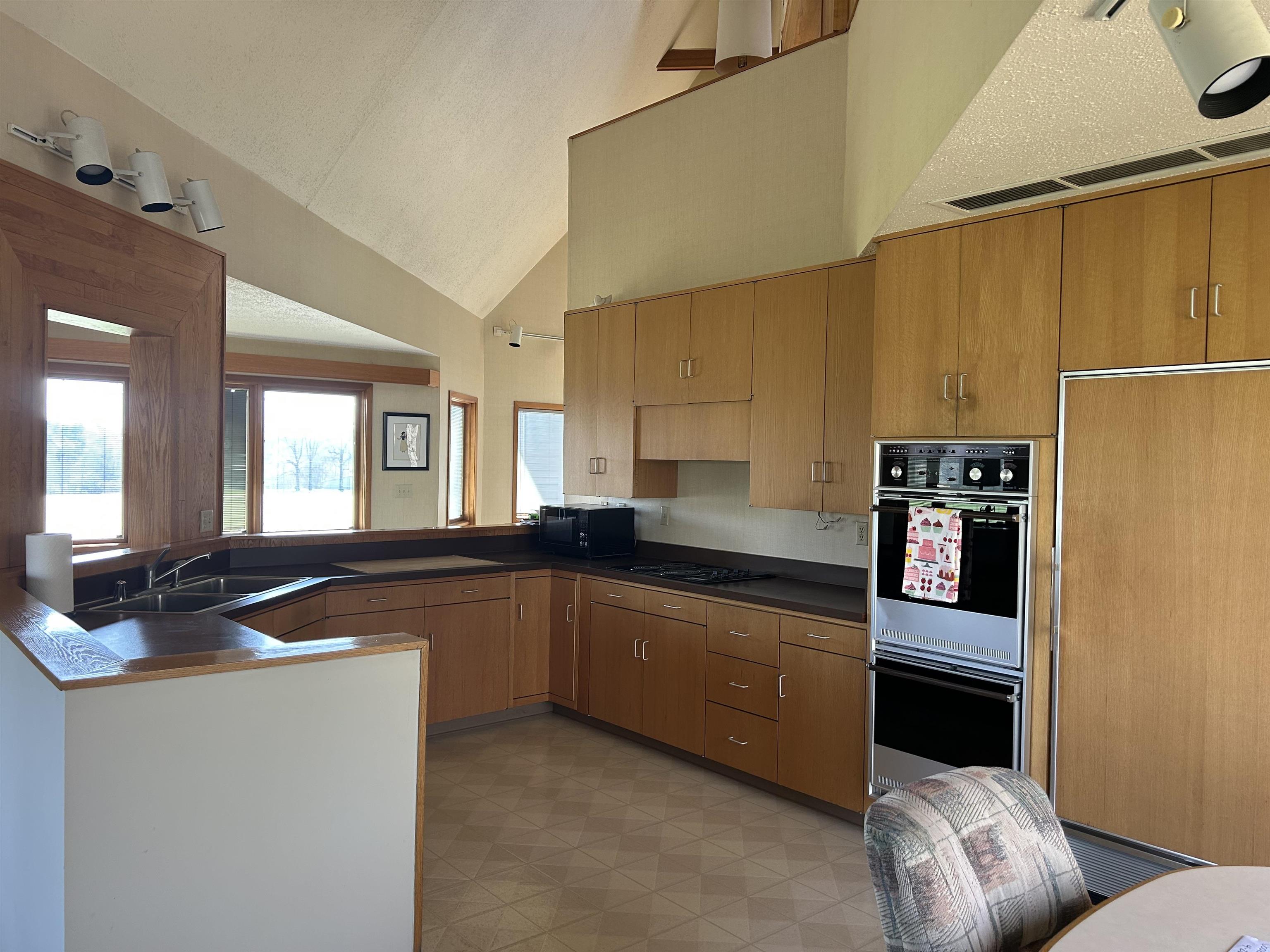 18573 Caledonia Road Caledonia, IL 61011 - Photo 8 of 36 a kitchen with granite countertop a sink and cabinets