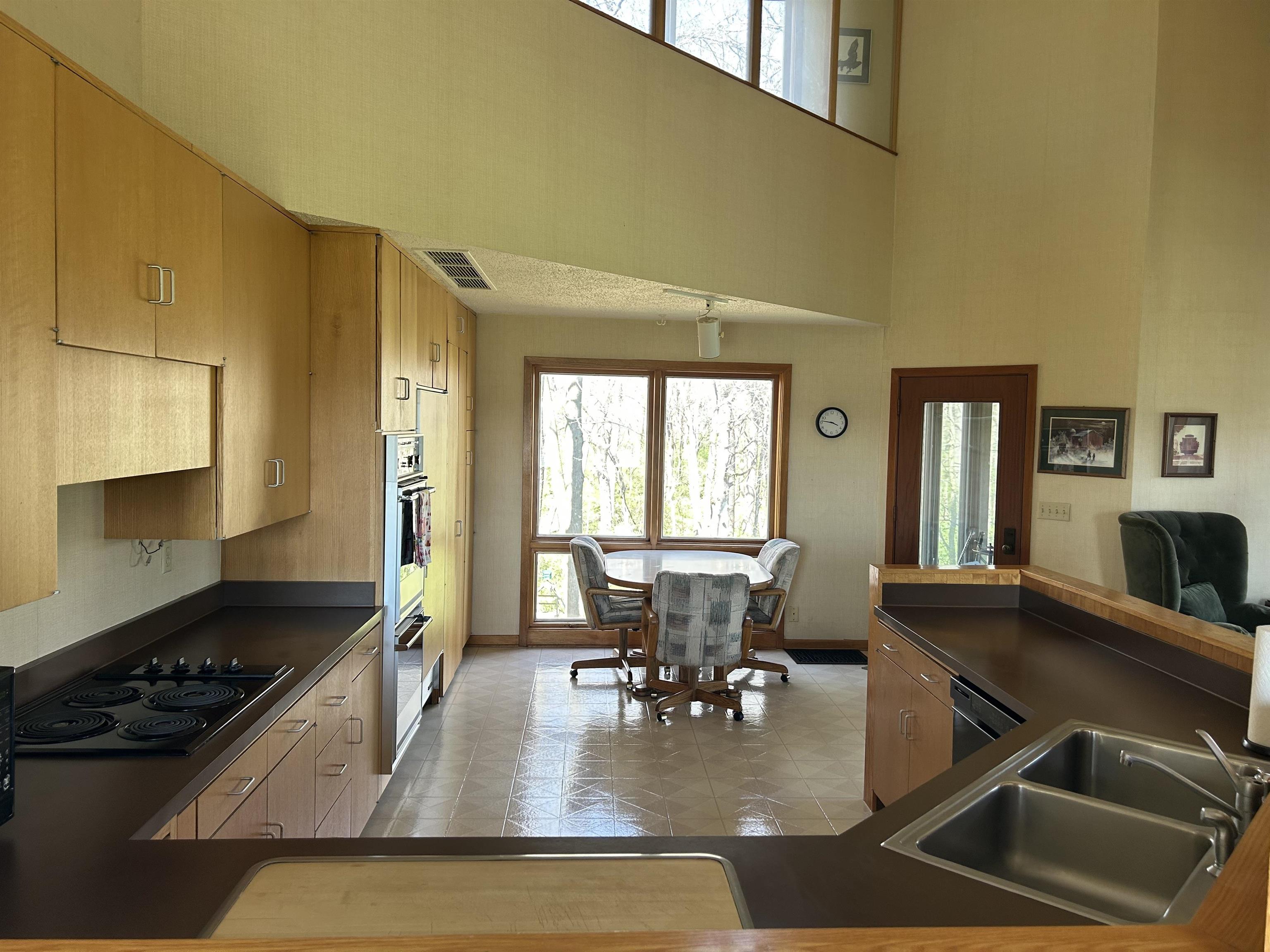 18573 Caledonia Road Caledonia, IL 61011 - Photo 9 of 36 a kitchen with a dining table and chairs