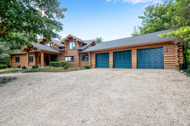 10917 Freeman Road Hebron, IL 60034 - Photo 2 of 16 front view of a house with a yard