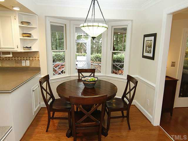 7908 Farnham Court Raleigh, NC 27615 - Photo 10 of 25 Enjoy the Breakfast Area Overlooking the Kitchen and the Private Serene View of the Wooded Backyard. Breakfast Area