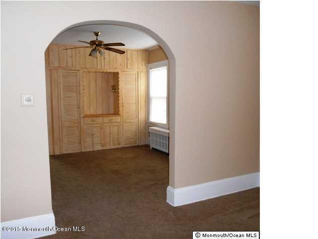 7-a-b Ellis Street Freehold, NJ 07728 - Photo 12 of 23 an empty room with windows and closet