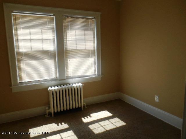 7-a-b Ellis Street Freehold, NJ 07728 - Photo 13 of 23 an empty room with a window