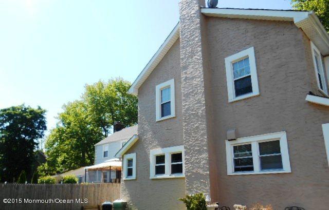 7-a-b Ellis Street Freehold, NJ 07728 - Photo 22 of 23 a front view of a house with a yard