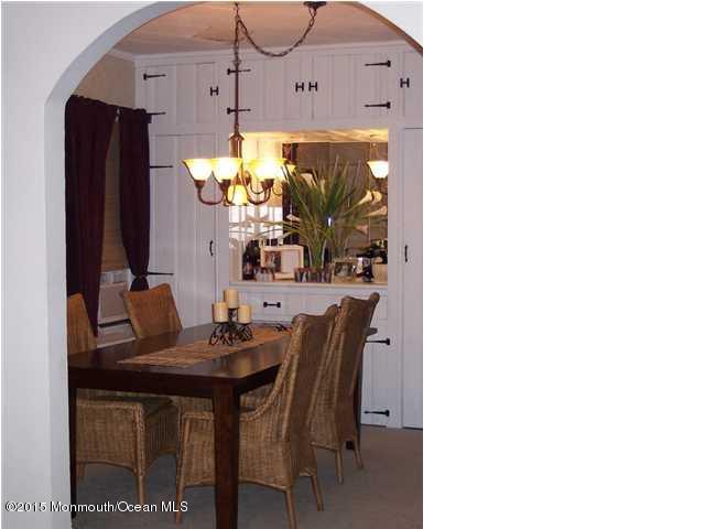 7-a-b Ellis Street Freehold, NJ 07728 - Photo 5 of 23 a dining room with furniture and a chandelier