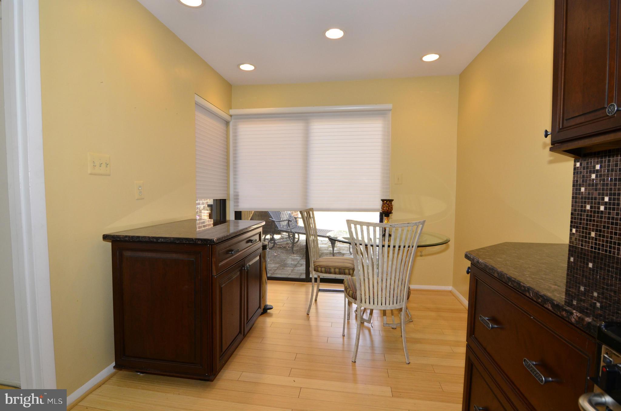 2161 Cabots Point Lane Reston, VA 20191 - Photo 8 of 26 a kitchen with stainless steel appliances granite countertop a stove and a refrigerator