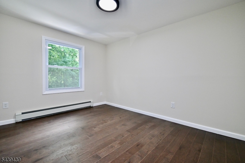 1 Appleseed Road Sussex, NJ 07461 - Photo 13 of 19 an empty room with wooden floor and windows
