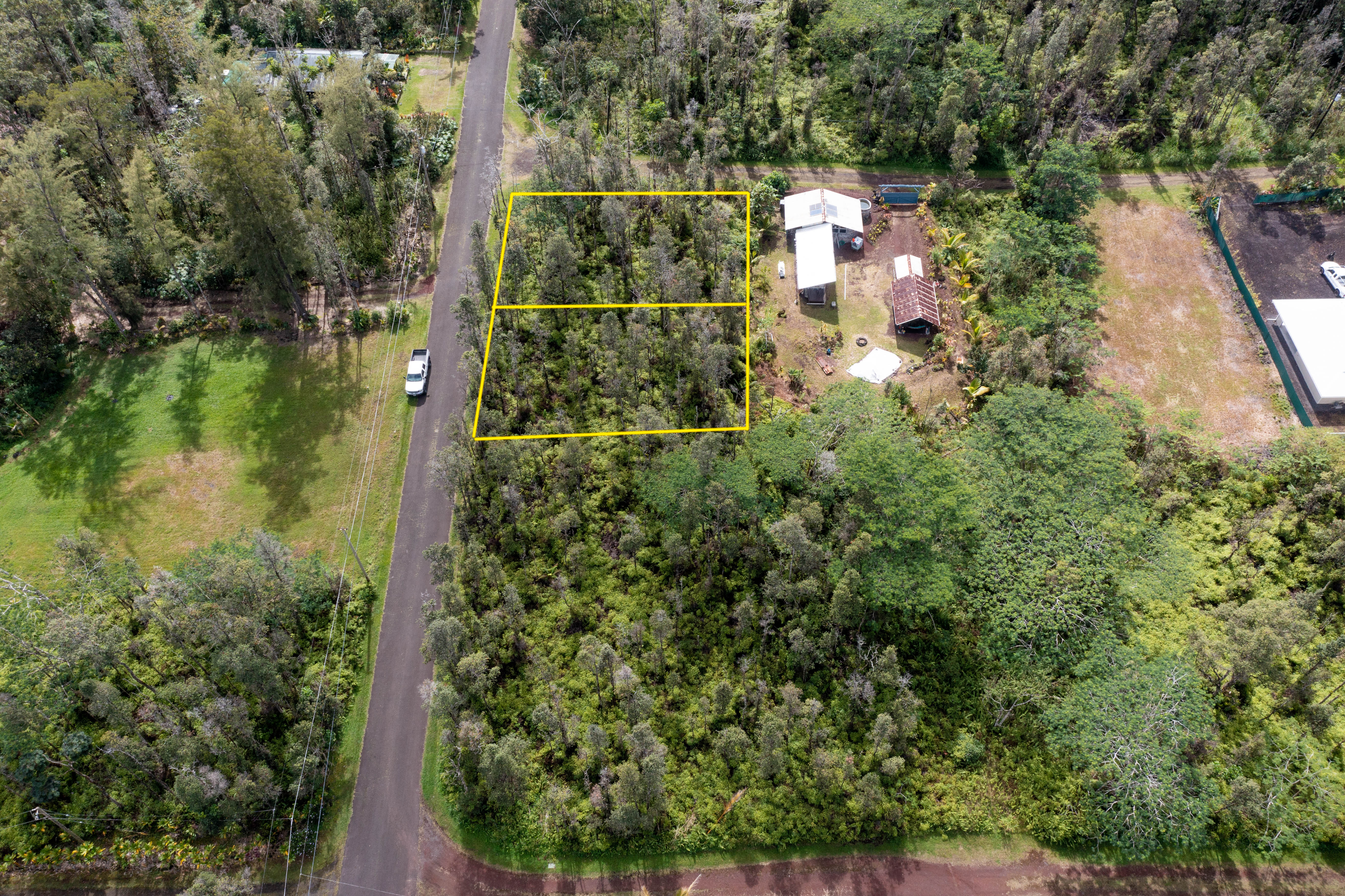 44 Seaview Road Pahoa, HI 96778 - Photo 15 of 22 an aerial view of residential houses with outdoor space and trees
