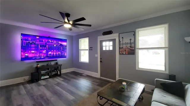 a view of a room with furniture window and wooden floor