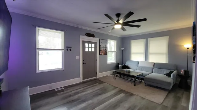 a living room with furniture and windows