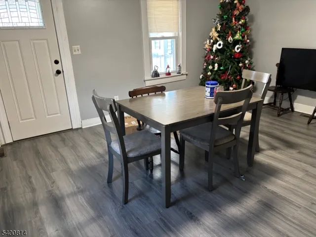 a view of a dining room with furniture and window