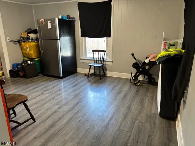a view of a workspace with furniture and wooden floor