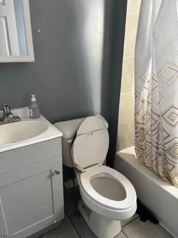 a white toilet sitting next to a bathroom sink